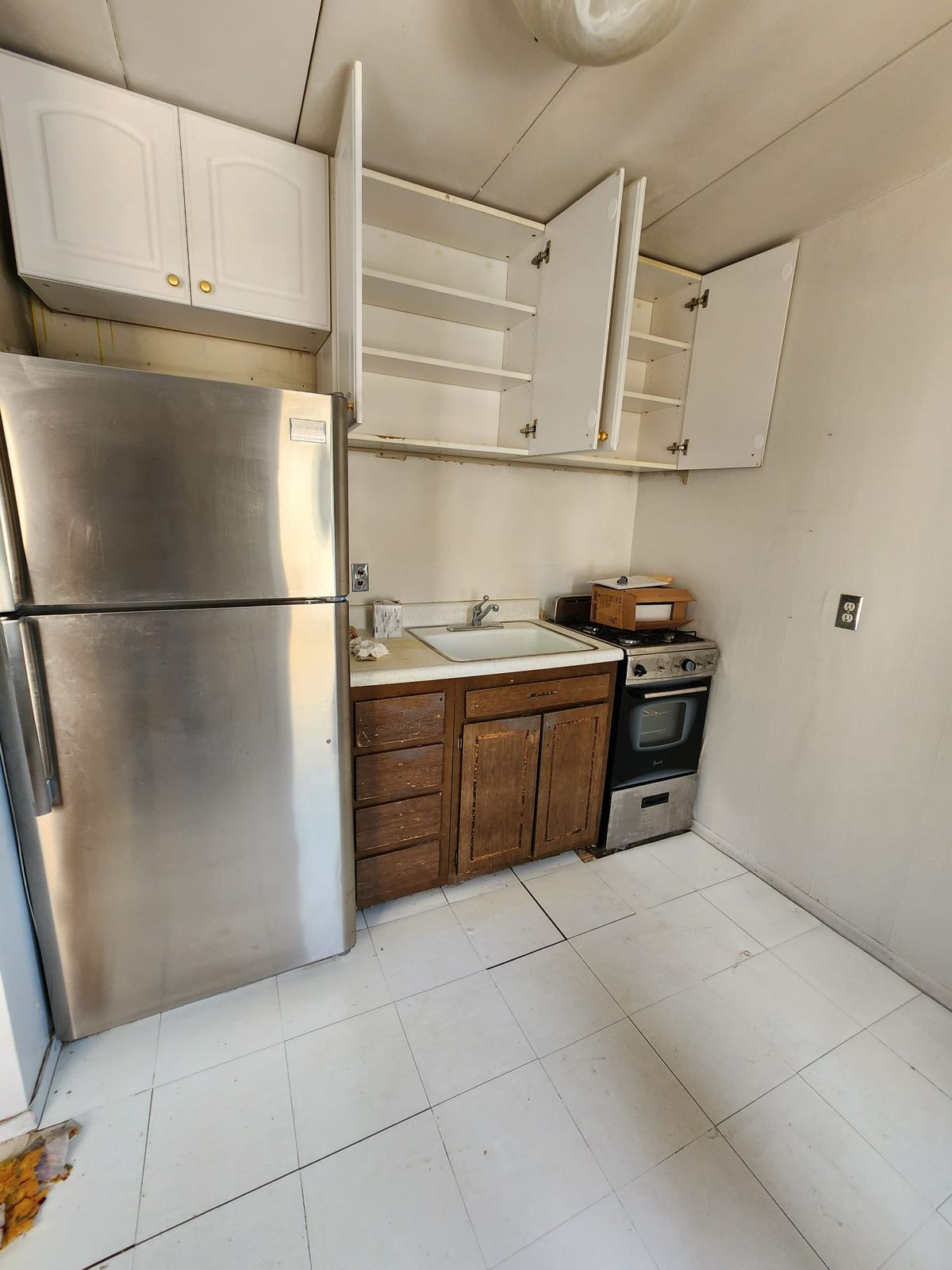kitchen remodeling Yonkers NY before photo by AlbStar Renovation dated kitchen cabinets