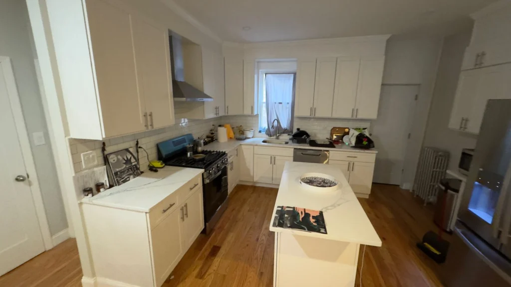 Completed kitchen remodel by AlbStar Renovation Yonkers NY — white kitchen with custom cabinets and quartz countertops