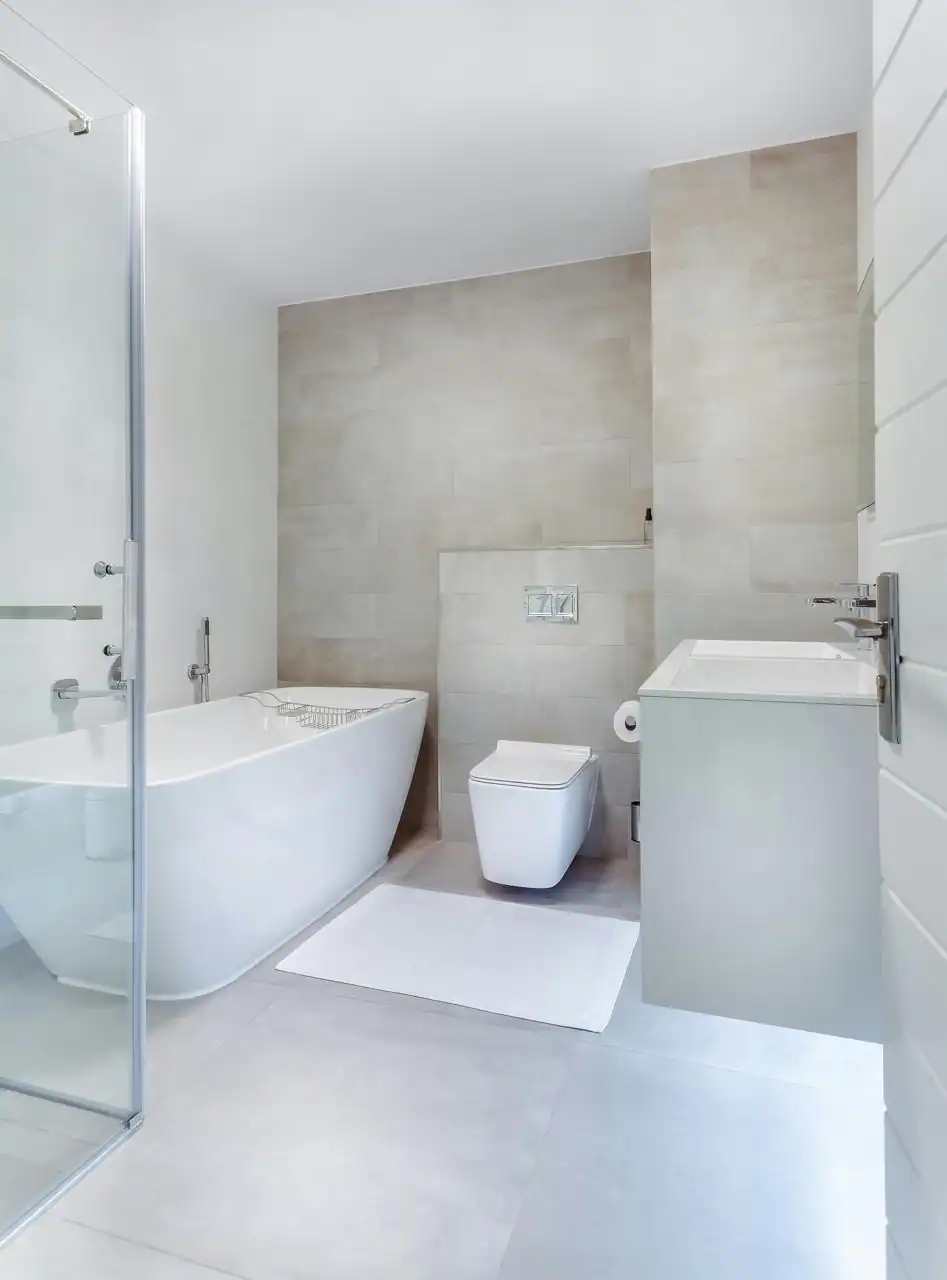 white finished bathroom with a white bathtub