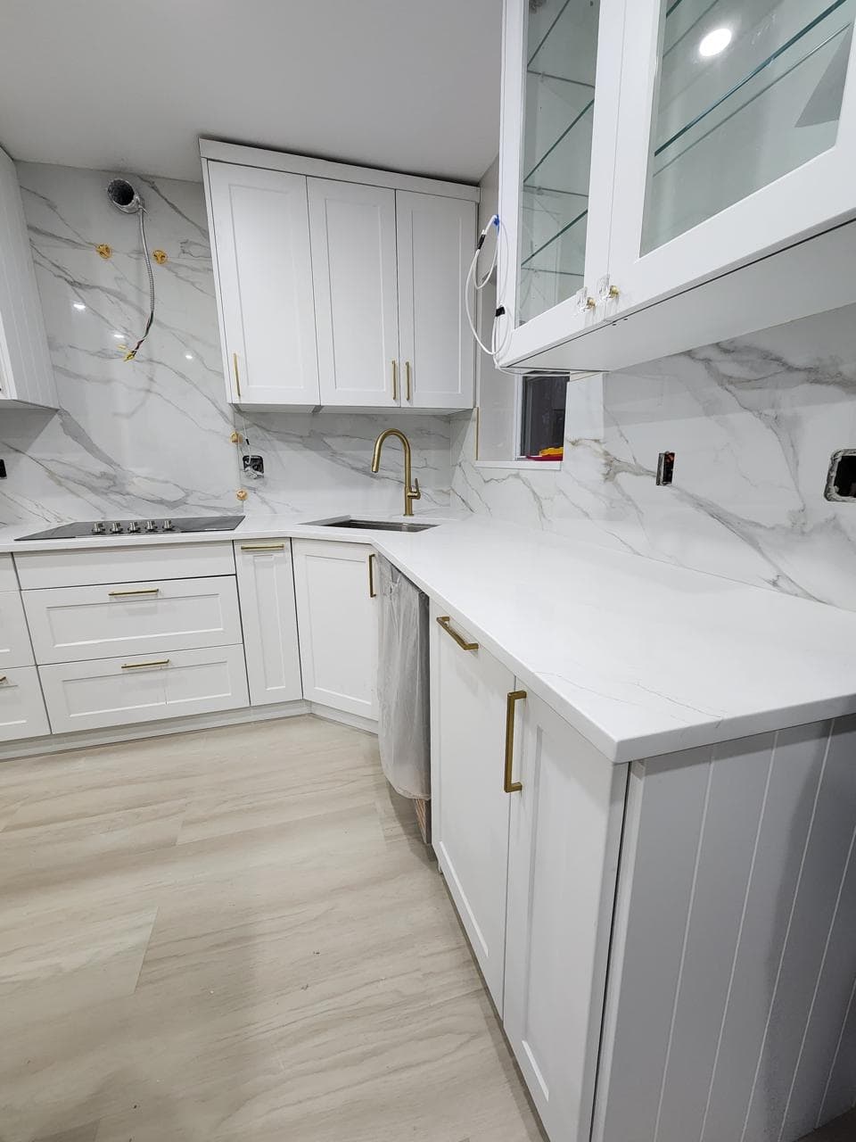 Kitchen remodeling project by AlbStar Renovation in Yonkers NY — gray cabinets with white quartz countertop and marble floor