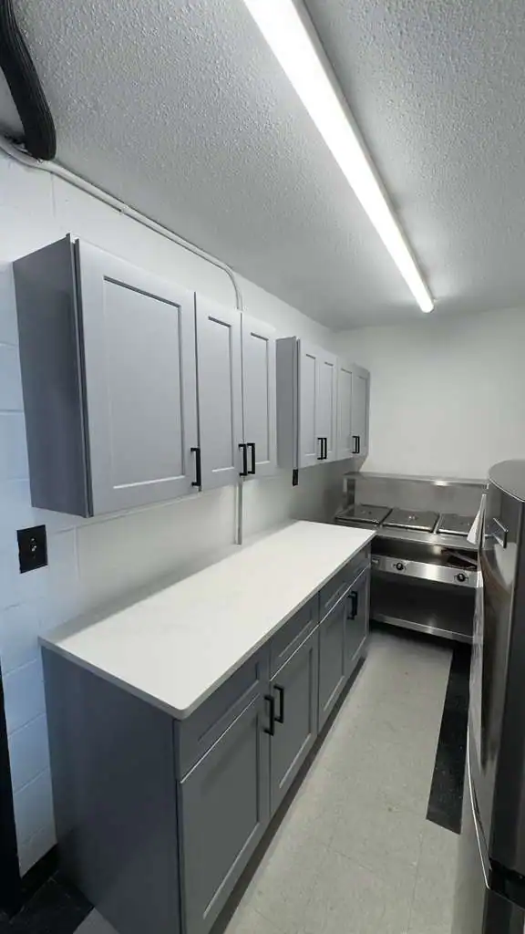 Community center kitchen remodeling Bronx NY — gray shaker cabinets white quartz countertops by AlbStar Renovation