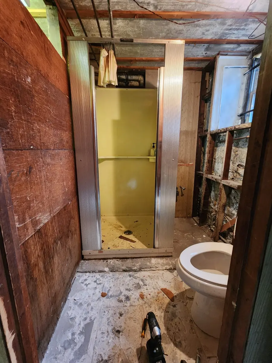 Bathroom renovation Bronx NY — before photo showing gutted bathroom with exposed walls by AlbStar Renovation