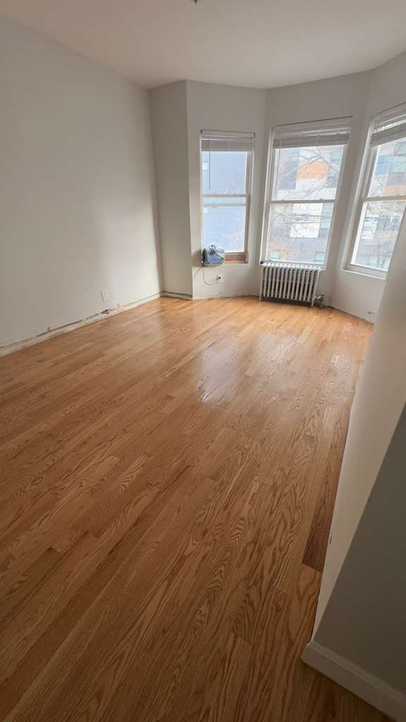 vinyl plank vs hardwood flooring in the Bronx NY — finished hardwood floor by AlbStar Renovation