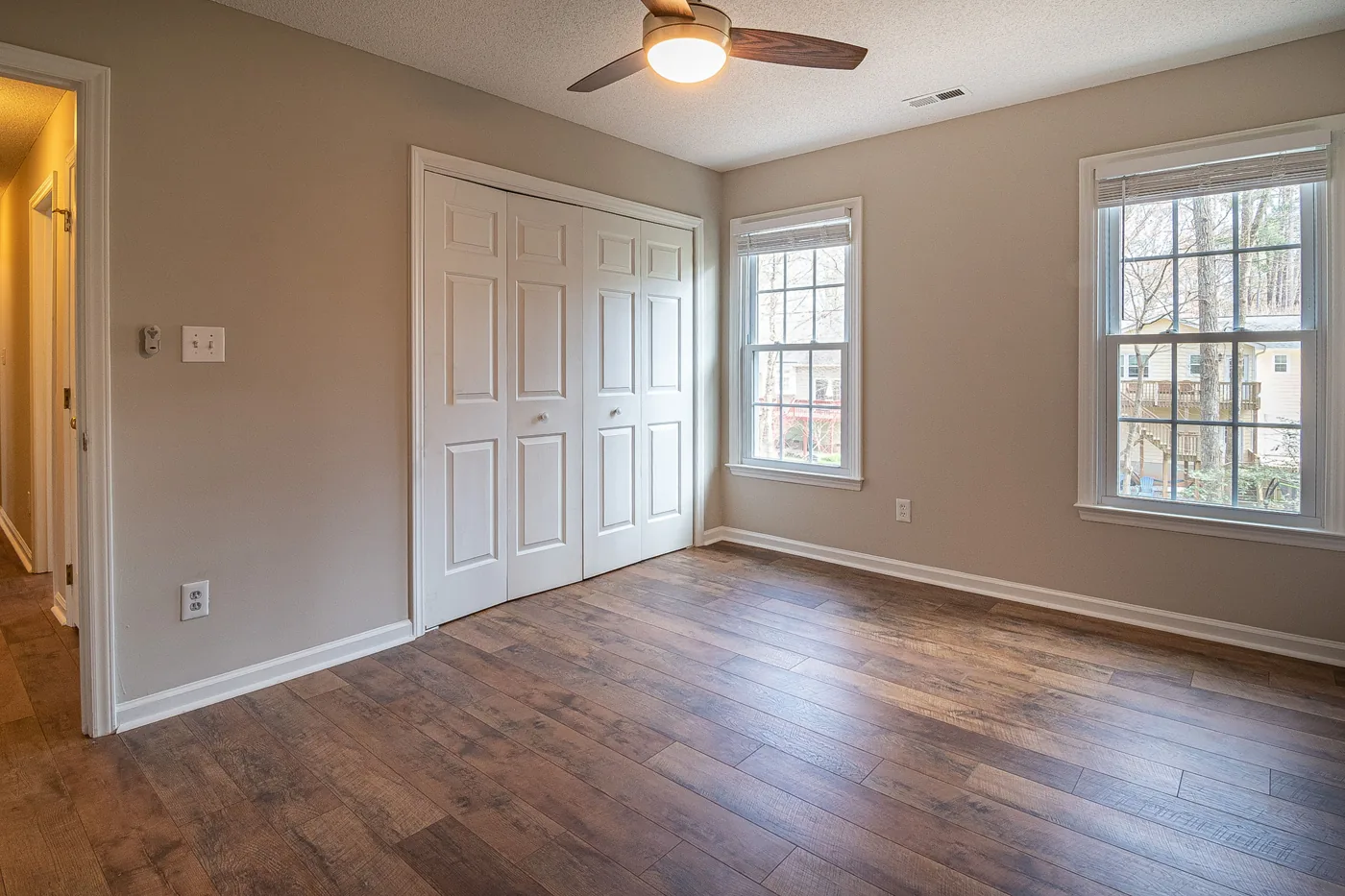 a bedroom with vanily floor and painted beige