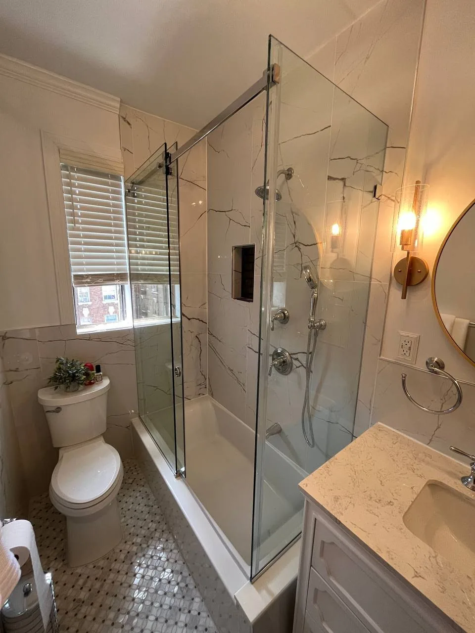 Bathroom renovation Yonkers NY — marble tile bathroom with frameless glass shower by AlbStar Renovation
