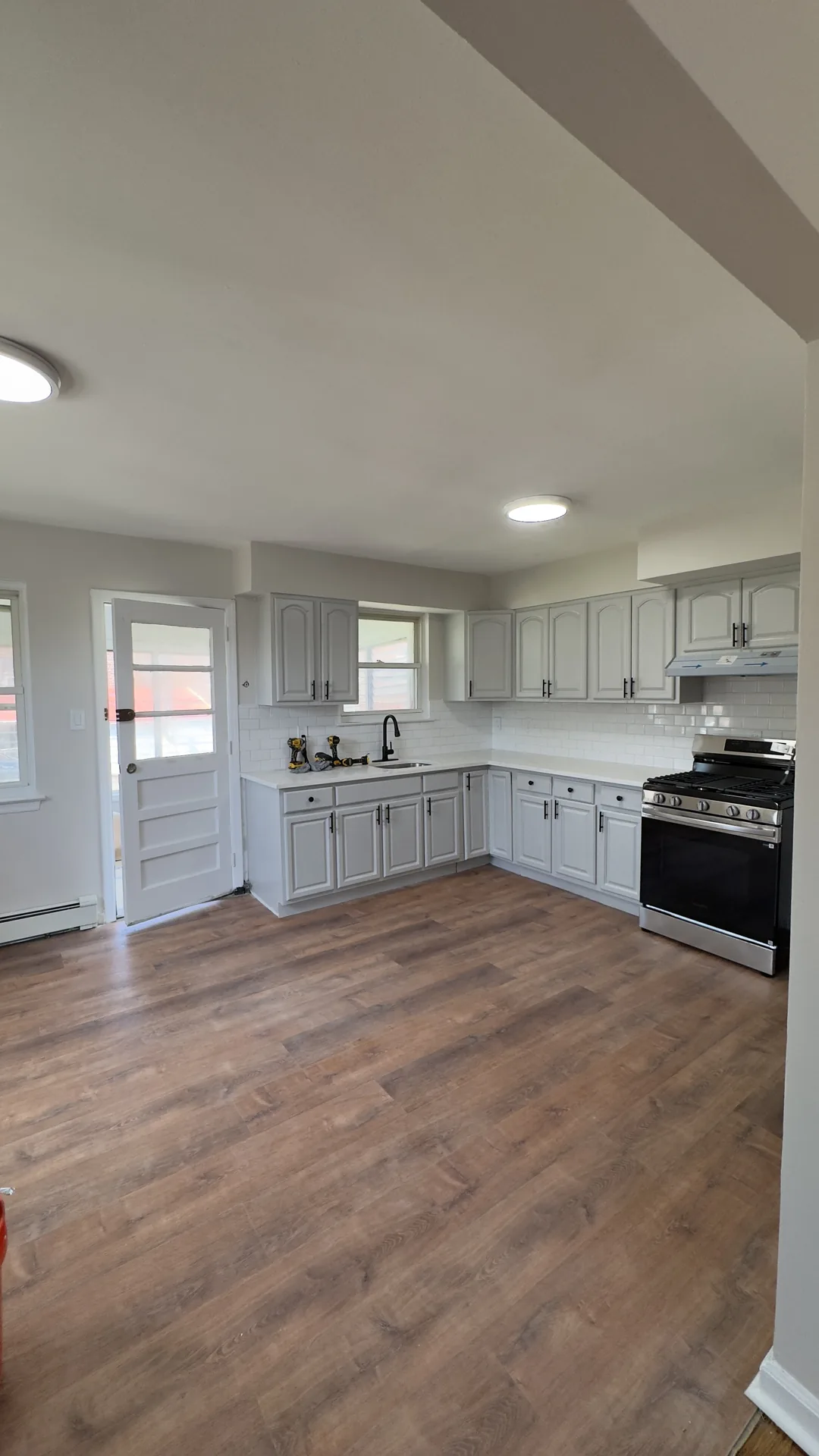 Kitchen remodeling Bronx NY — gray shaker cabinets with subway tile backsplash by AlbStar Renovation